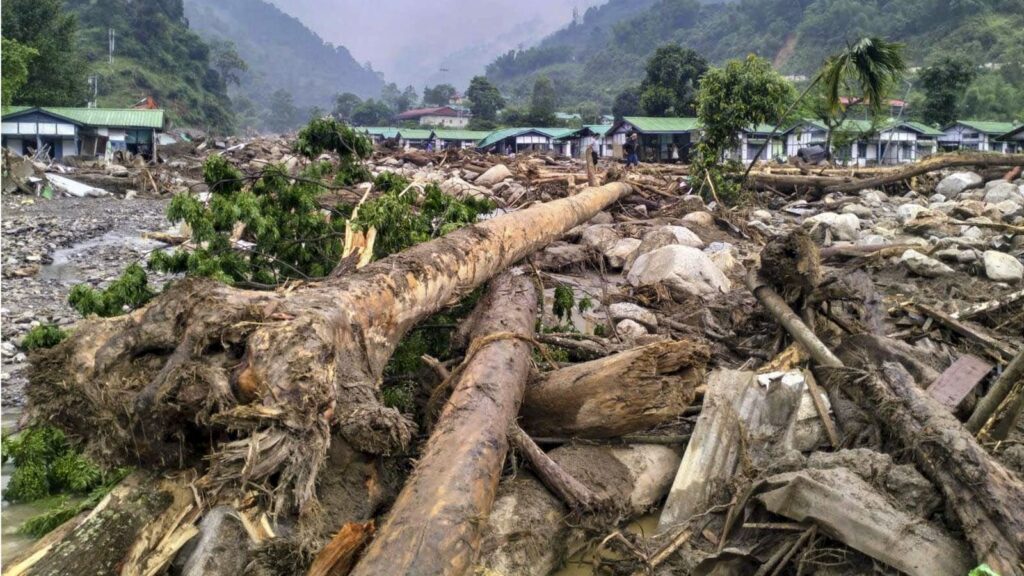 Fallen trees and debris block a road after a monsoon landslide in Arunachal Pradesh.