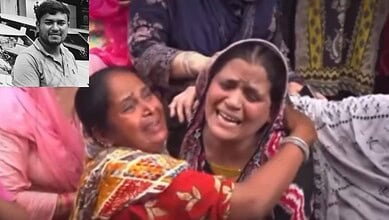 Women crying and mourning at a funeral or memorial gathering.