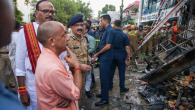Uttar Pradesh Chief Minister Yogi Adityanath and Deputy Chief Minister Brajesh Pathak inspects the site after a fire broke out at a commercial building in Aliganj, Lucknow