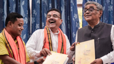 West Bengal Chief Minister Suvendu Adhikari and State Finance Minister Swapan Dasgupta display copies of the state Budget after its presentation in the West Bengal Legislative Assembly, in Kolkata