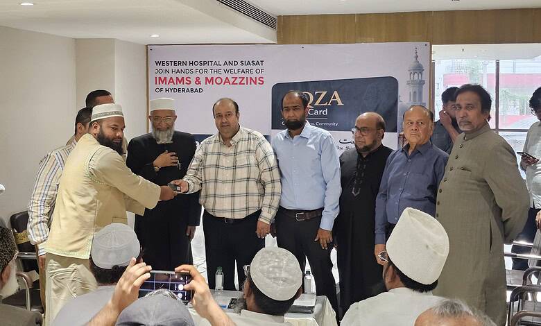 Group of Imams and officials at Western Hospital receiving healthcare cards in Hyderabad.