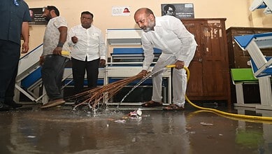 Bandi Sanjay Kumar cleans a school