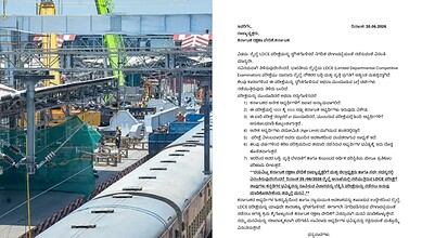Construction site with cranes and railway tracks, no people visible, during daytime.