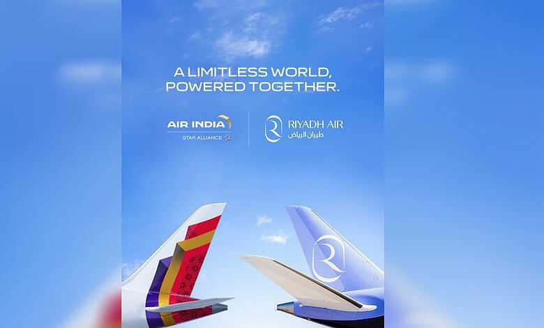 Air India and Riyadh Air aircraft tails flying in a clear blue sky with clouds.