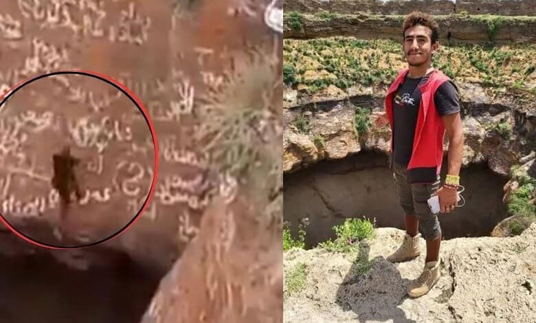 Young man exploring ancient rock carvings and archaeological site outdoors.
