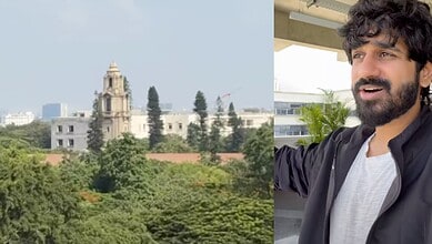 Lush greenery and historic buildings at IISc Bengaluru with a man enjoying the view.