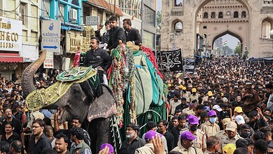 Large crowd gathers for Bibi-ka-Alam procession during Muharram in Hyderabad.