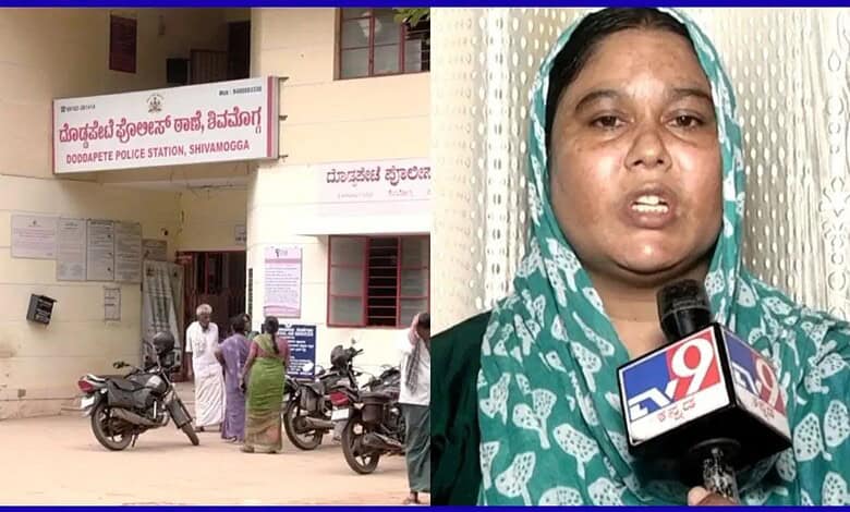 Police station in Shivamogga with people and motorcycles outside.