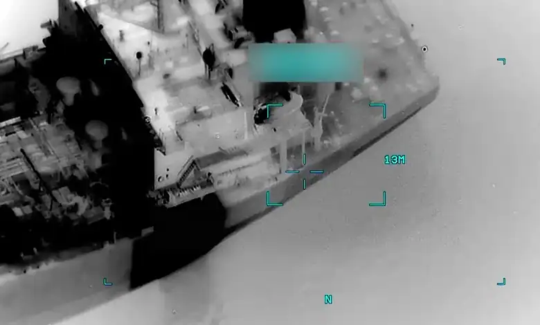 Aerial view showing a commercial vessel targeted during a reported US military strike in the Gulf of Oman.