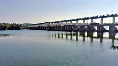 Thumbe Dam with low water levels in coastal Karnataka during monsoon season.