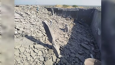 Earthquake destruction showing collapsed buildings and cracked ground in an urban environment.