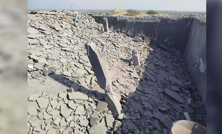 Earthquake destruction showing collapsed buildings and cracked ground in an urban environment.