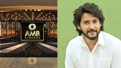 The entrance of AMB Cinemas with illuminated signage and modern design.