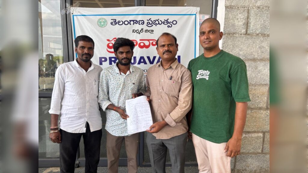 Family members of a Telangana worker submit a representation with NRI Advisory Committee member Swadesh Parikipandla at Prajavani in Nirmal.
