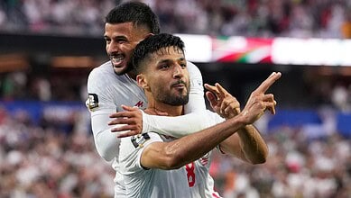 Iran football players celebrating a goal during the World Cup match against New Zealand.