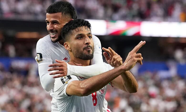 Iran football players celebrating a goal during the World Cup match against New Zealand.