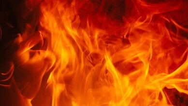 Fire flames with intense orange and yellow hues, creating a dynamic and energetic visual.