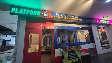 Train-themed restaurant named Platform 65 in Hyderabad with colourful exterior and interior.