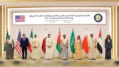 GCC ministers and officials at US-GCC joint ministerial meeting with flags and banners.