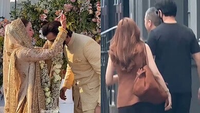 Pakistani couple's wedding ceremony with traditional attire and floral decorations.