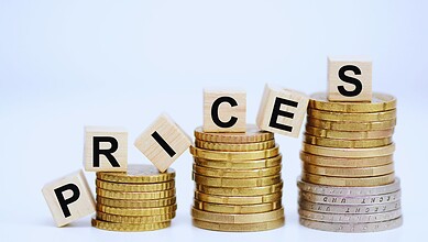 Financial growth with stacked coins and letter blocks spelling "PRICE".