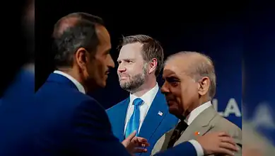 Qatar Prime Minister and Sharif exchanging a handshake at a formal event.