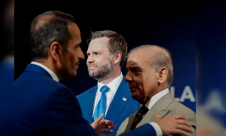 Qatar Prime Minister and Sharif exchanging a handshake at a formal event.