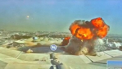 Explosion at industrial site with large fire and smoke cloud.