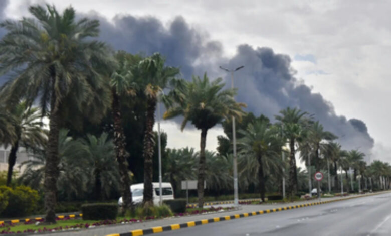 Black smoke billows into the sky near Kuwait International Airport following a reported drone strike in Kuwait City.