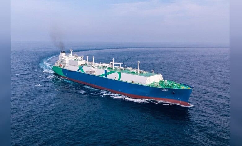 Oil tanker ship navigating through open waters with a clear sky and calm sea.