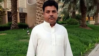 Manzoor Ahmed, an Indian expatriate from Madhya Pradesh, poses outdoors in Kuwait before his death in the airport attack.