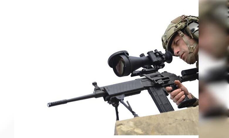 Indian soldier with a sniper rifle equipped with Israeli optics system for enhanced targeting.