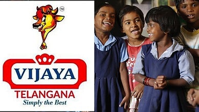 Children smiling and laughing together with Vijaya Telangana logo in the image.