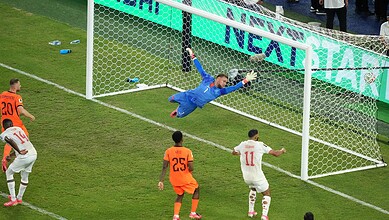 Moroccan goalkeeper makes a save during a World Cup shootout match.