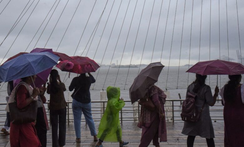 Kochi: Visitors at the Marine Drive on a rainy afternoon, in Kochi, Saturday, May 23, 2026. (PTI Photo)
