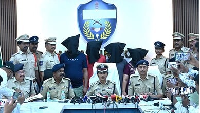Police officers and officials addressing media during a press conference on security measures.