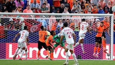 Netherlands and Tunisia players compete in a football match during the FIFA World Cup 2026.