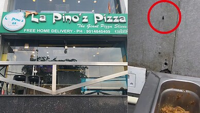Pest droppings and damage on the sidewalk outside La Pino'z Pizza in Hyderabad.