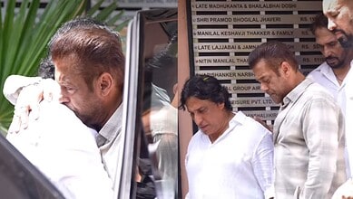 A woman and two men inspecting documents outside The Siasat Daily office in India.