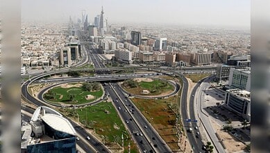 Aerial view of Riyadh skyline with major highways and modern skyscrapers in Saudi Arabia.