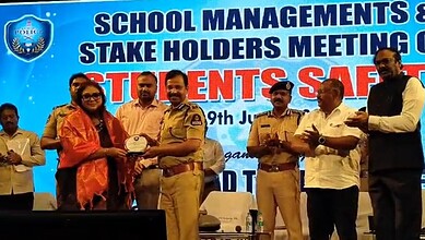 Police officers and school officials at a school management event in Hyderabad.