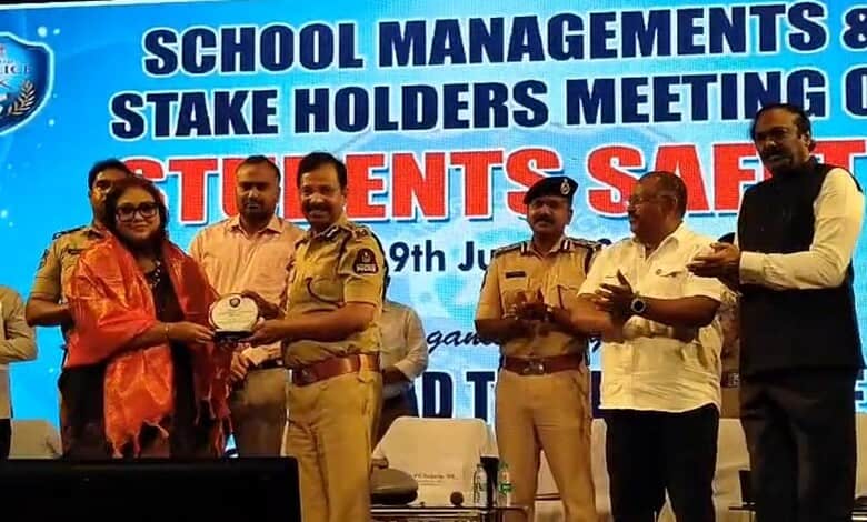 Police officers and school officials at a school management event in Hyderabad.