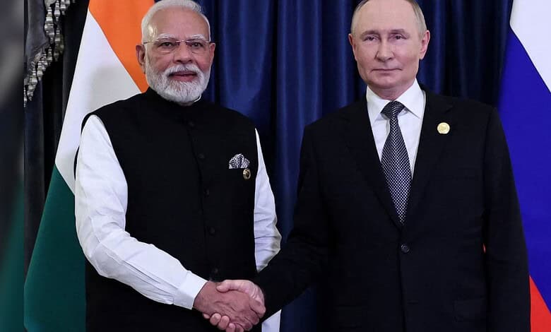 India-Russia leaders shake hands during official meeting.