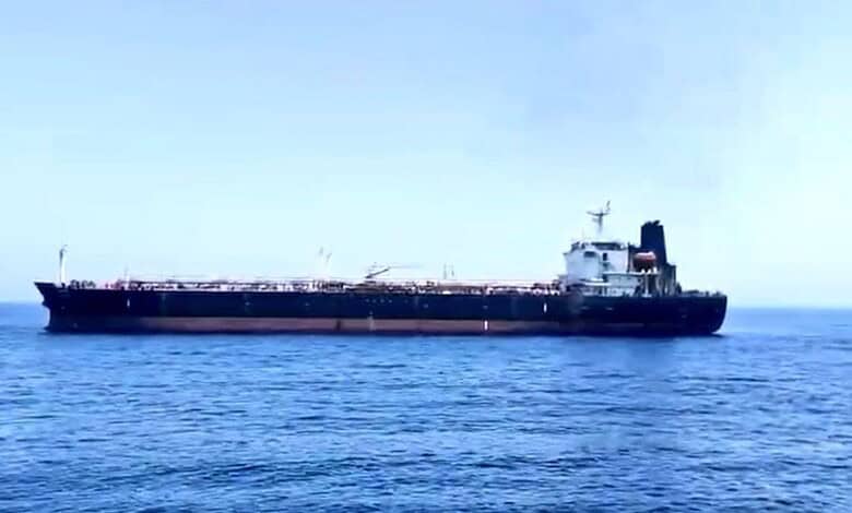 Oil tanker ship sailing on calm sea under clear sky, maritime transportation, shipping industry, large ve.