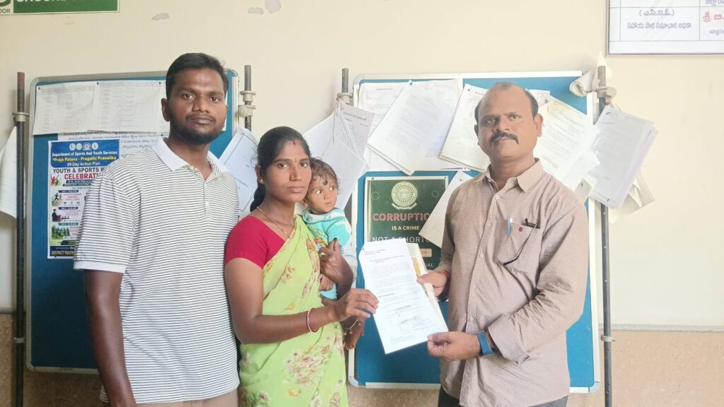 Shirisha, wife of Sailu Dusgam, submits a petition to Telangana State NRI Advisory Committee member Swadesh Parikipandla in Nizamabad seeking assistance for her husband stranded in Oman.