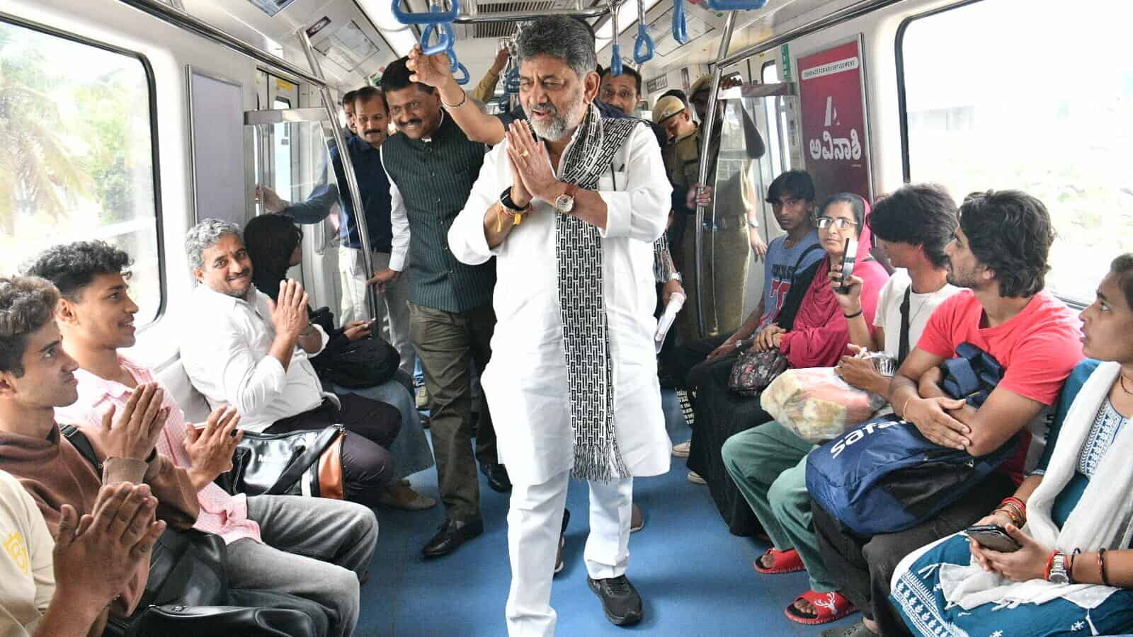 A man in traditional attire leading a prayer on a crowded bus with diverse passengers.