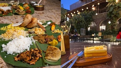 Traditional Indian meal served on a banana leaf with rice, vegetables, and curries at an outdoor restaura.