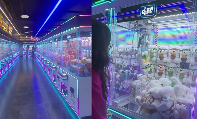 Claw machine arcade with colourful neon lighting and plush toys inside, vibrant gaming environment.