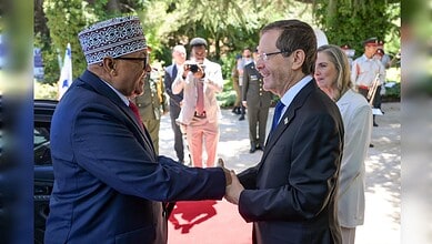 Somaliland President Abdirahman Mohamed Abdullahi shakes hands with Israeli President Isaac Herzog during a state visit in Israel.