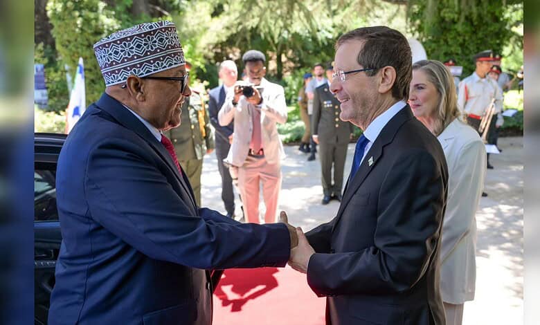 Somaliland President Abdirahman Mohamed Abdullahi shakes hands with Israeli President Isaac Herzog during a state visit in Israel.